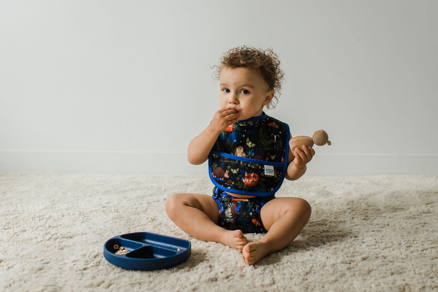 Baby wearing Thirsties Pocket Bib and Duo Wrap in Nightlife